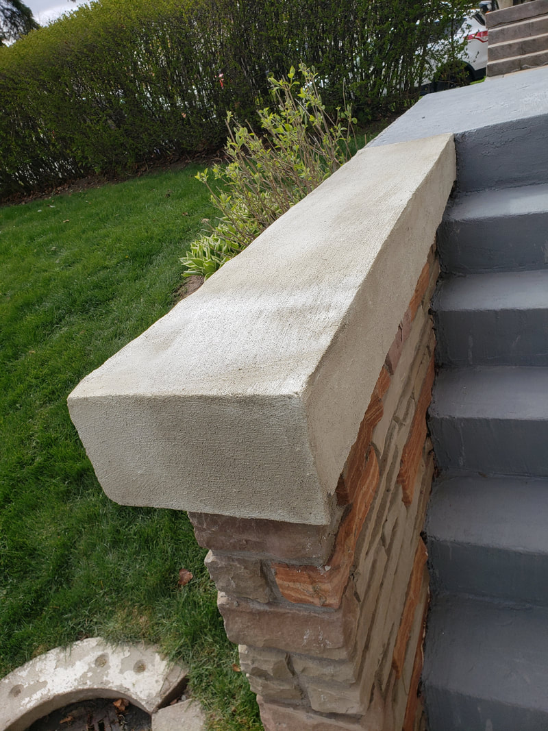 Stone retaining wall and capped pillar